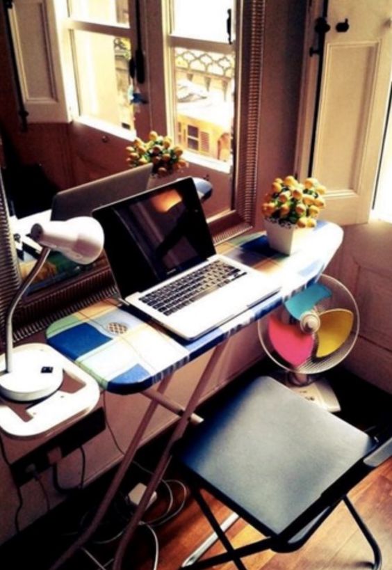An old ironing board as a portable desk