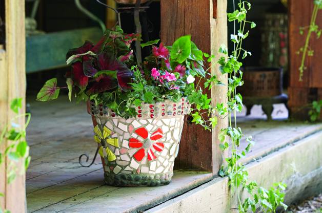 Decorate flower pots with mosaic tiles